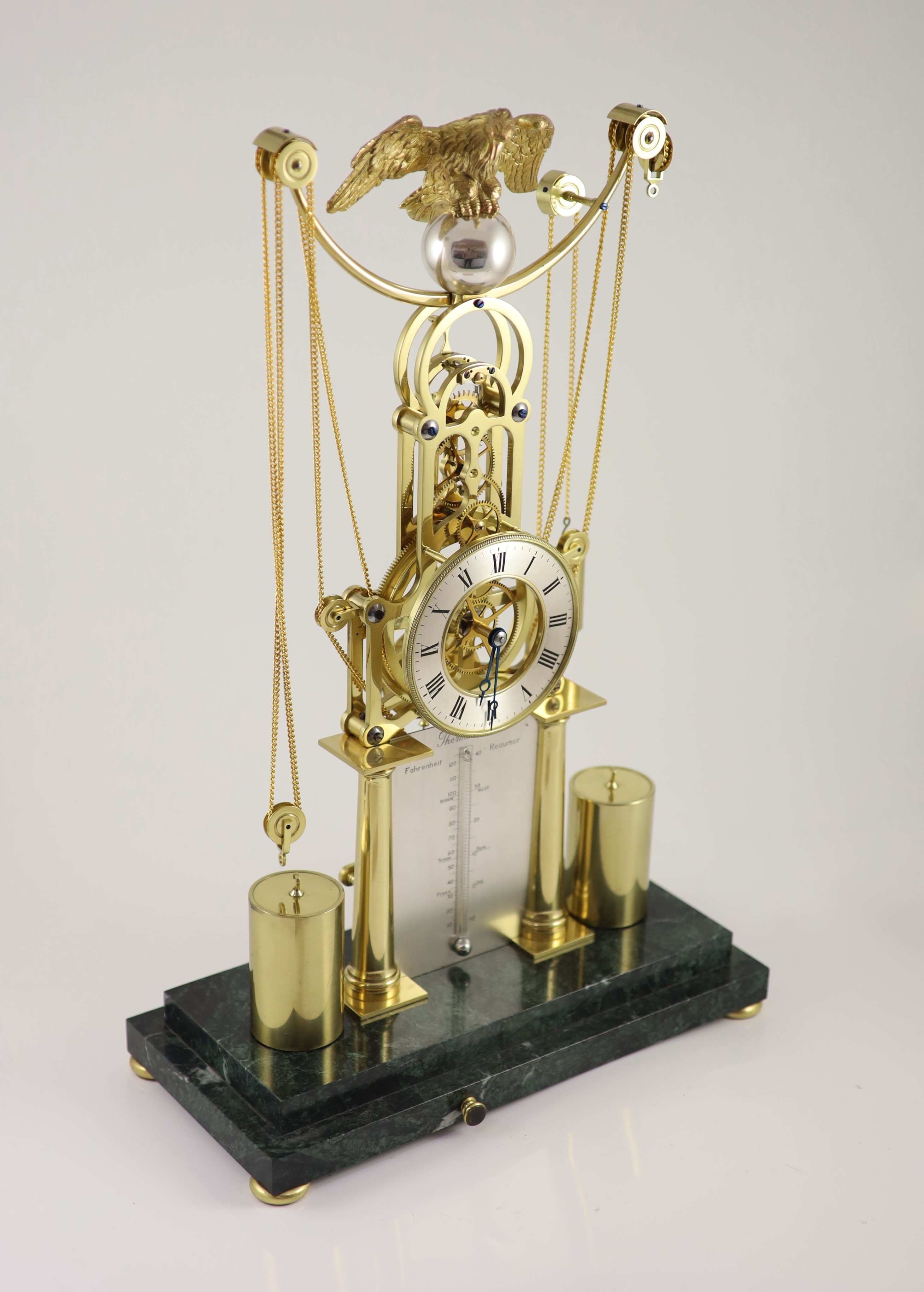 An F.H.Whitlock Empire style brass skeleton clock H 54cm. W 35cm. D 16cm.